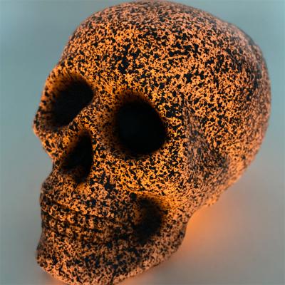 China Europe Skeleton Bones and Spooky Scene Skull for Halloween Halloween Decoration Props 20cm Stone Look Light Up Skull for sale