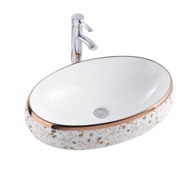 China Oval Ceramic Bathroom Sink Gold Color Plating Countertop Hand Wash Basin Modern High Quality Copper Luxury Basin for sale