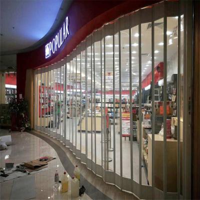 China Luxurious Commercial Appearance Folding Door Polycarbonate Door Transparent PC Slat For Supermarket for sale