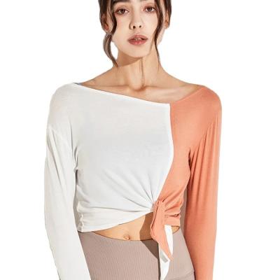 China Breathable Women's Contrasting Color Lace-Up Quick-Drying Long Sleeve Yoga Fitness Top Loose Sweatshirt for Workout and Sports for sale