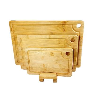 China OEM/ODM Accepted Rectangle Bamboo Three-Piece Cutting Board Set with Hanging Holes for sale