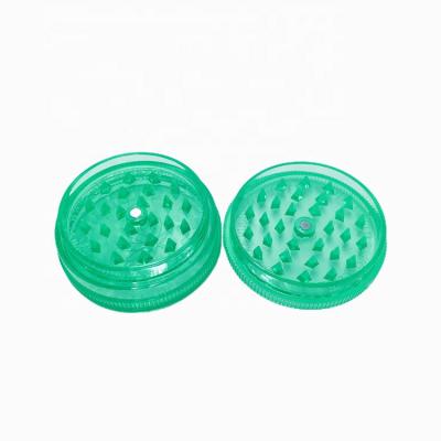 China Jingle Tobacco 2021 Small Translucent Portable Plastic Weed Tabacco Weed Grinder 63mm for sale