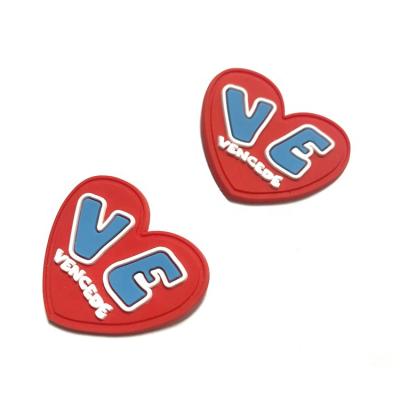 China Viable Heart Form 2D Soft Plastic T-Shirt Logo Badge Rubber Patch for sale