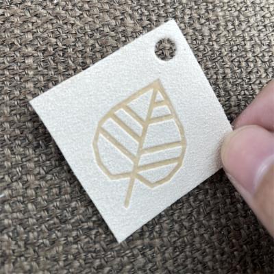 China Sustainable Suede Label For Clothing Adhesive Label Sewn Faux Suede Labels for sale