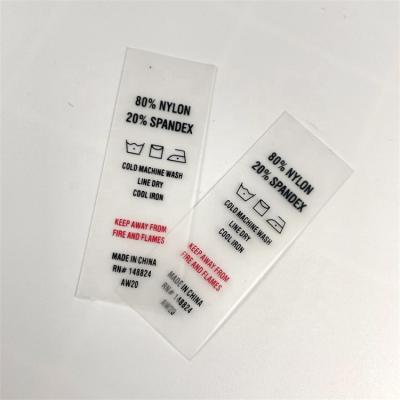 China Viable Normal Size 50*20mm TPU Screen Printing Label Printing Two Logo Care Label Clear Color for sale