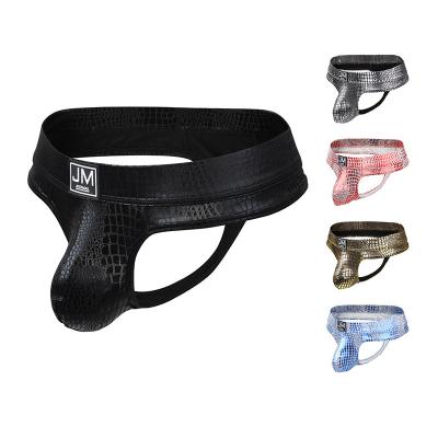 China Breathable Sexy Gay Men's Underwear T Leather Jockmail Brand Black Python Skin Thong Leather Thong Back for sale