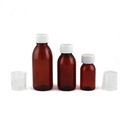 China Pharmaceutical Plastic Syrup Liquid Medicine Amber Bottles With Measuring Cup for sale