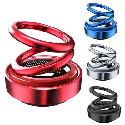 China 2021 Solid Solar Powered Rotary Rings Suspension Aromatherapy Car Air Freshener Double Rotating Interior Dashboard Ornament for sale