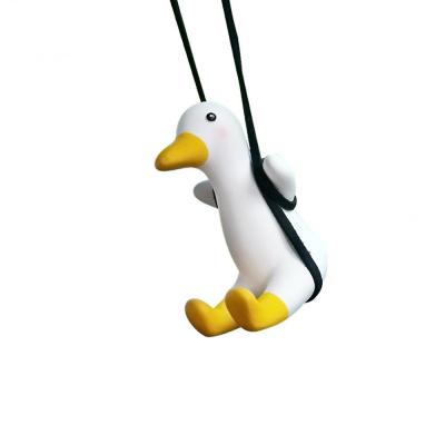 China Anime Car Driving Duck Pendant Hanging Swing Mini Small Duck Car Pendant Decoration Rearview Cute Reflect Charms Ornament for sale