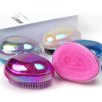 China Mini Egg Shape Magic Luxury Mini Hair Comb Wet Hair Brush Detangling Home Shiny Hair Brush for sale