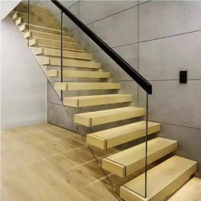 China Villa Design Floating Staircase Invisible Steel Stringer With Wooden Tread Glass Railing for sale