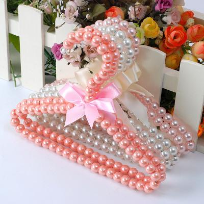 China Sustainable Dog Clothes Girl Heart Pearl Clothes Racks Cat Pet Goods Clothes Racks for sale