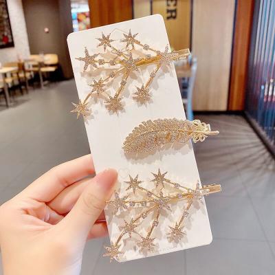 China Diamond Star Hairpins Shape Ladies Hair Clip Set Fashion Gold Rhinestone Hairpin Feather Star Hair Clip for sale