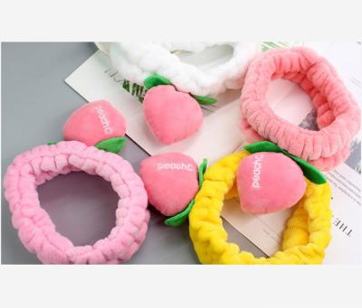 China Beautiful Fashion Peach INS Fashion Popular Pink Fruit Headband Elastic Face Wash Hair Band For Women for sale