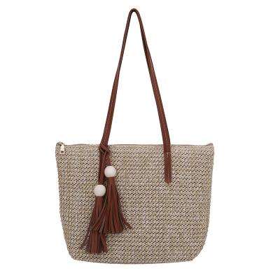 China Lady 2021 Summer New Fashion Simple Shoulder Bag Straw Woven Bag Tassel Tote Wild Bag For Women for sale