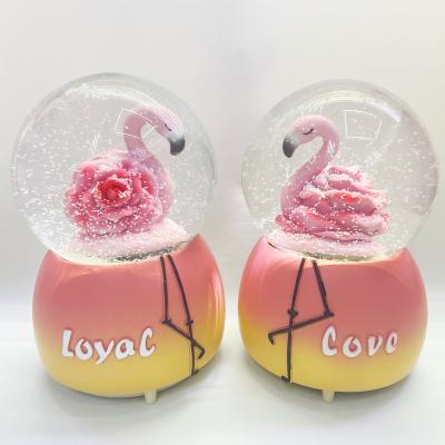 China Wholesale Folk Art Manufacture Promotion Flamingosn Snow Globe With Music Of Snow Globe Love Snow Globes Musical for sale