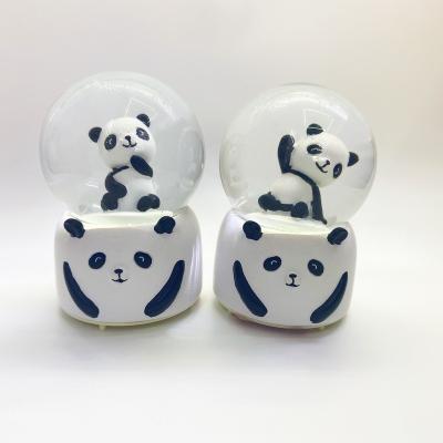 China YIWU BAIWEN folk art manufacture globe wholesale hot battery snow panda musical promotion gift for sale