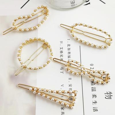 China Unique Luxury Elegant Loose Fancy Pearl Hair Clip Gold Metal Hair Clips Hair Clips Hairpins For Woman Girl Lady for sale