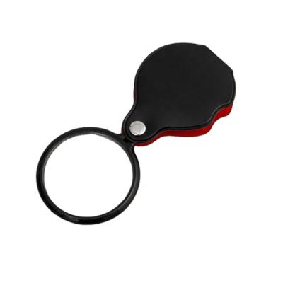 China Mini Case Portable Leather Reading Books Folding Magnifying Glass Mobile Handle Magnifier for sale