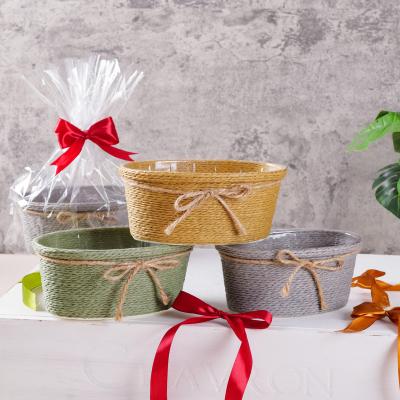 China Woven Oval Paper Rope Basket Viable With Plastic Jar With Bowknot As Flower Candy Storage Baskets And Gift Basket for sale