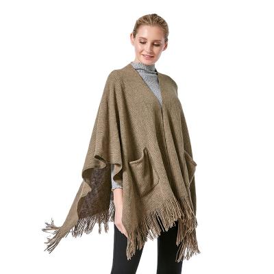 China Knitted tassel with pockets knitted shawl with pockets soft faux cashmere shawls for women tassel scraf for sale