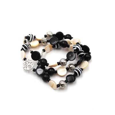 China Newest Design Trendy Flexible Multi Rows Broom Shell Murano Glass Beads Broom Charm Black White Black Bracelet For Women for sale