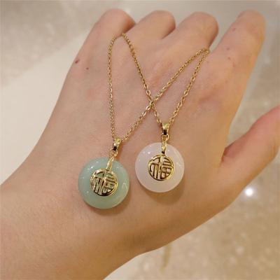 China FASHIONABLE Design Light Luxury Sense Niche Temperament Wild Hetian Jade Pendant Clavicle Chain Safe Necklace for sale