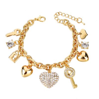 China TRENDY Fashion Gold Plated Bangle Women Jewelry Luxury Key Pendant Heart Shaped Charm Bracelets for sale