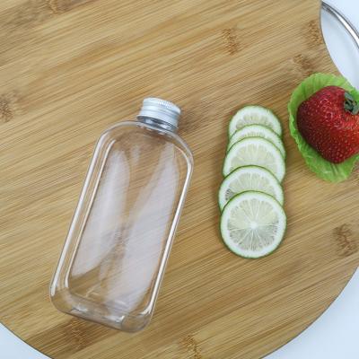 Chine Bouteilles d'eau plates de PLA 300ml avec des chapeaux Juice Milk Plastic Smoothie Bottles à vendre