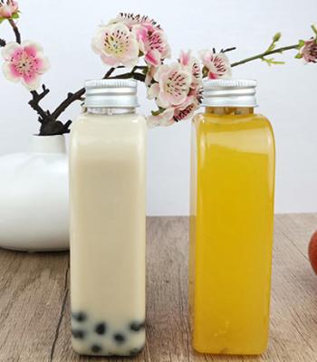 China Flache Plastiktrinkflaschen Juice Milks 400ml mit Kappe zu verkaufen