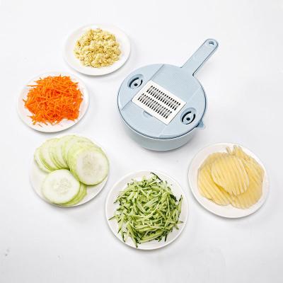 China Hot Selling Sustainable Amazon 12 in 1 Handheld Multifunctional Onion Cutter Fruit Vegetable Slicer Potato Peeler Manual Cleaver for sale