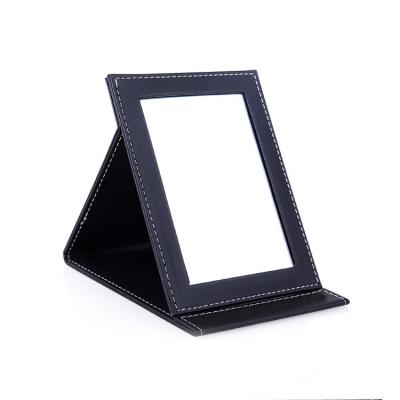 China Custom Cheap Square One Side Foldable PU Leather Table Standing Mirror for sale