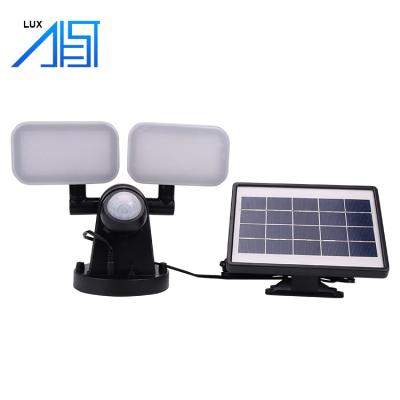 China Solar Power Adjustable Super Bright Double Heads Outdoor/New Designed Garden/Wall Waterproof Panel Led Flood Light for sale