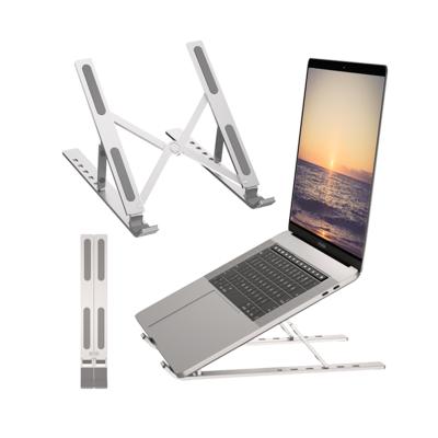 China (Size)Adjustable Stylish Creative Contracted Ultrathin Laptop Stand Up Withsilicon Pad Cheap Notebook Stand Holder for sale