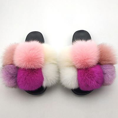 China CUSHIONING Ladies Fur Slippers Plush Ball Slippers Cross Belt Leather Slippers for sale