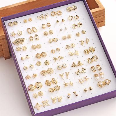 China Cute 50 pairs of boxes mixed to wholesale all kinds of small gold earrings hollow hypoallergenic ladies mix earrings for sale