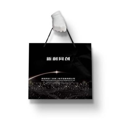 China Recycled Materials Custom logo luxury paper bag printing shopping and promotion bag for sale