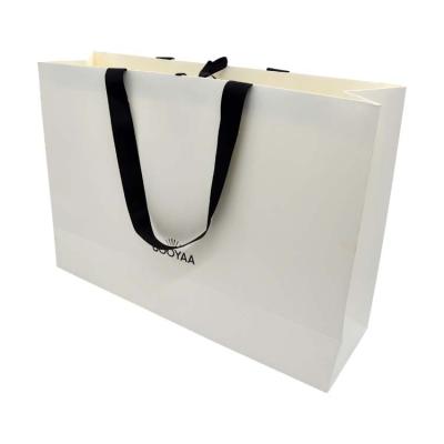 China Recycled Materials Custom logo color printing luxury shopping gift paper bags for sale