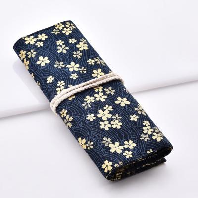 China High quality kabuki fabric fashion fabric eye flower bag cosmetic makeup brush bag for sale