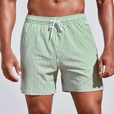 China Men Plus Size Four Way Stretch Vertical Striped Swimming Trunks With Eye Left Sublimation Beach Shorts for sale