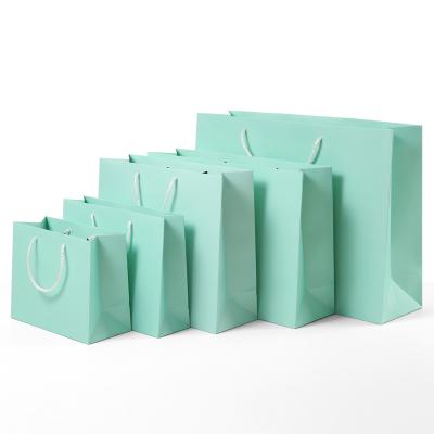 China Recyclable Blue Custom Paper Bags With Handles Kraft Paper Apparel Gift Packaging Paper Bags Shoes Shopping Paper Bags With Your Own Logo for sale