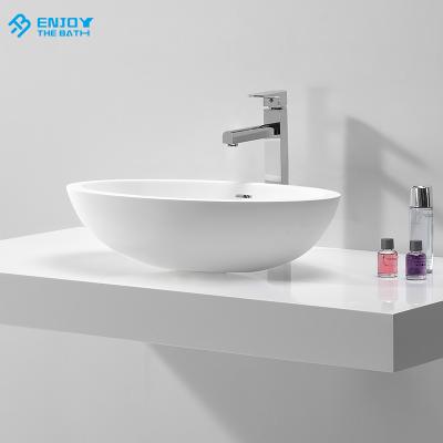 China Modern Solid Outdoor Stone Basin Small Resin White Above Counter Vanity Sink for sale