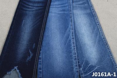 Cina La sanforizzazione Stretchable ritorce facilmente il tessuto del denim di 10 Oz per i jeans scarni delle donne dell'inverno della primavera in vendita