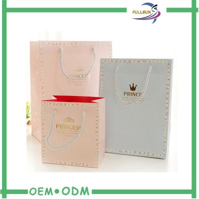 China Luxury Custom Printed Gold Foil Shopping Gift Paper Bag with Logo Printing for sale