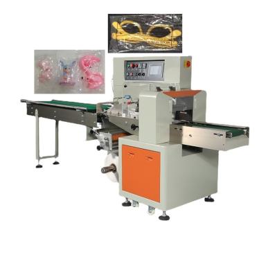 China food kids toys packing machine, doll packing machine, trinket packing machine for sale