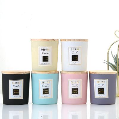 China Creative Multicolor Frosted Transparent Home Decoration Candle Jars With Black Wooden Lids Candle Jars In Bulk for sale