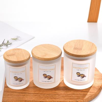 China Home Decoration Factory Supply 4oz 6oz 8oz 10oz 12oz 14oz Glass Candle Jars Frosted Candle Jars With Wooden Lids for sale