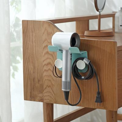 China Wall Mounted Bathroom Hair Dryer Holder Disposable Hair Dryer Storage Rack Hair Dryer Bracket for sale