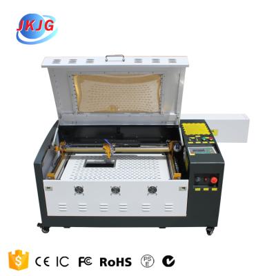 China Laser Engraving Reci tube car mat solar cell wooden foam 100w 4060 CO2 acrylic engraving machi for wood acrylic leather for sale