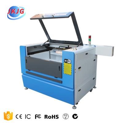 China Laser CUTTING CE certificate furniture laser cutting machine 6090 for knitting fabric laser cutting machine for clothes for sale